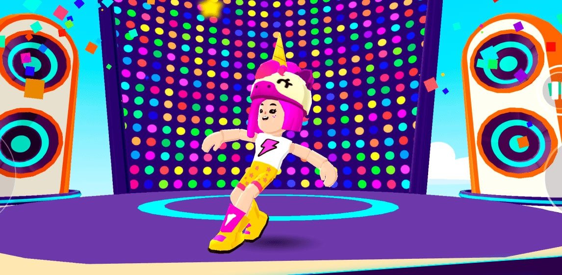 Grupo Movile lança Afterverse, produtora subsidiária da PlayKids que produzirá games mobile - imagem mostra uma cena do game PKXD com um avatar de uma garota de cablo rosa e boné de unicórnio dançando. Atrás é possível ver uma pita de dança com duas caixas de som tocando música