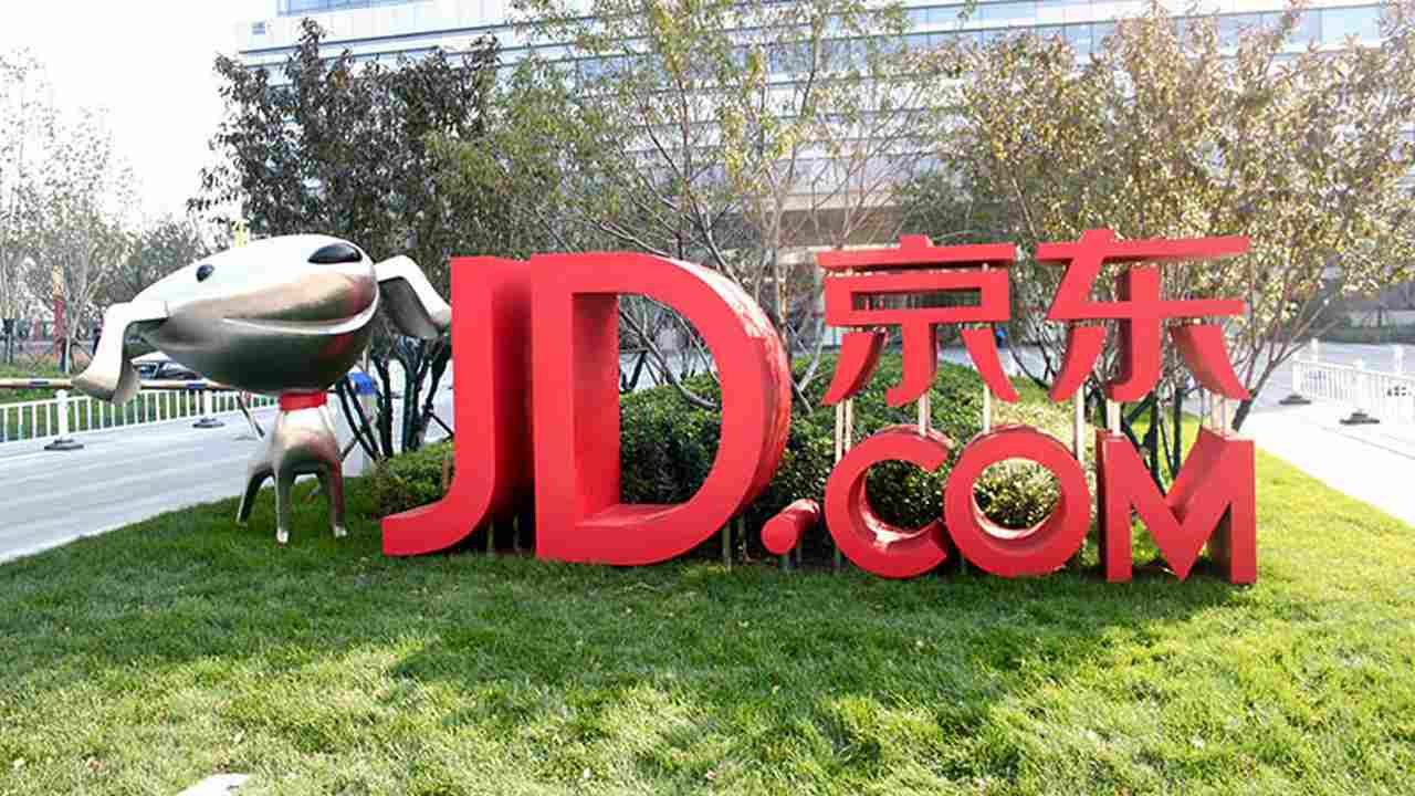 Banner e logo da Loja JD.com primeira que aceita criptomoeda chinesa - Divulgação