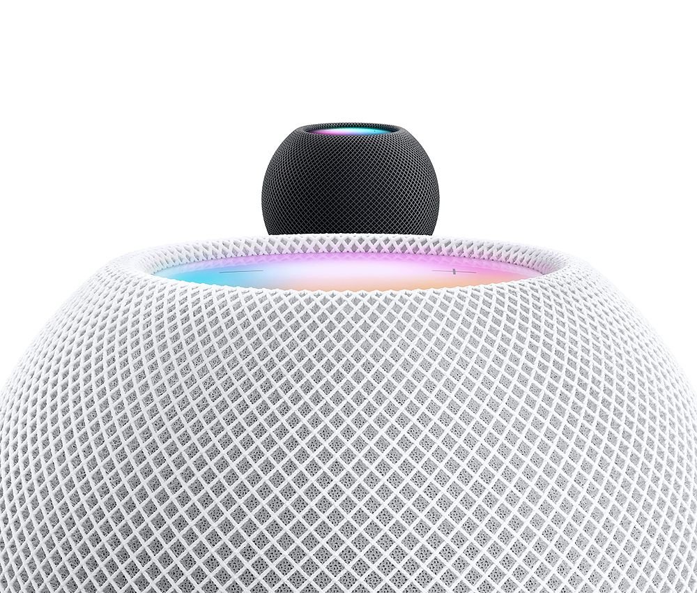 Imagem de dois HomePod Mini, nas cores preto e branco